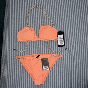 Brand is ViX. Size for both top and bottoms are a Medium. Color is orange.